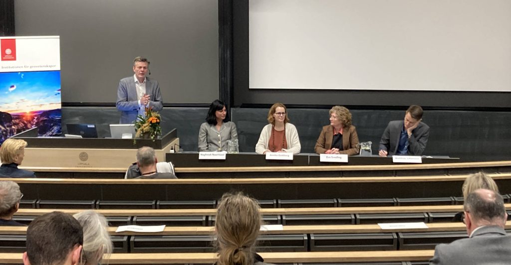 Mikael Karlsson standing on the left of the panel composed of three women and one man